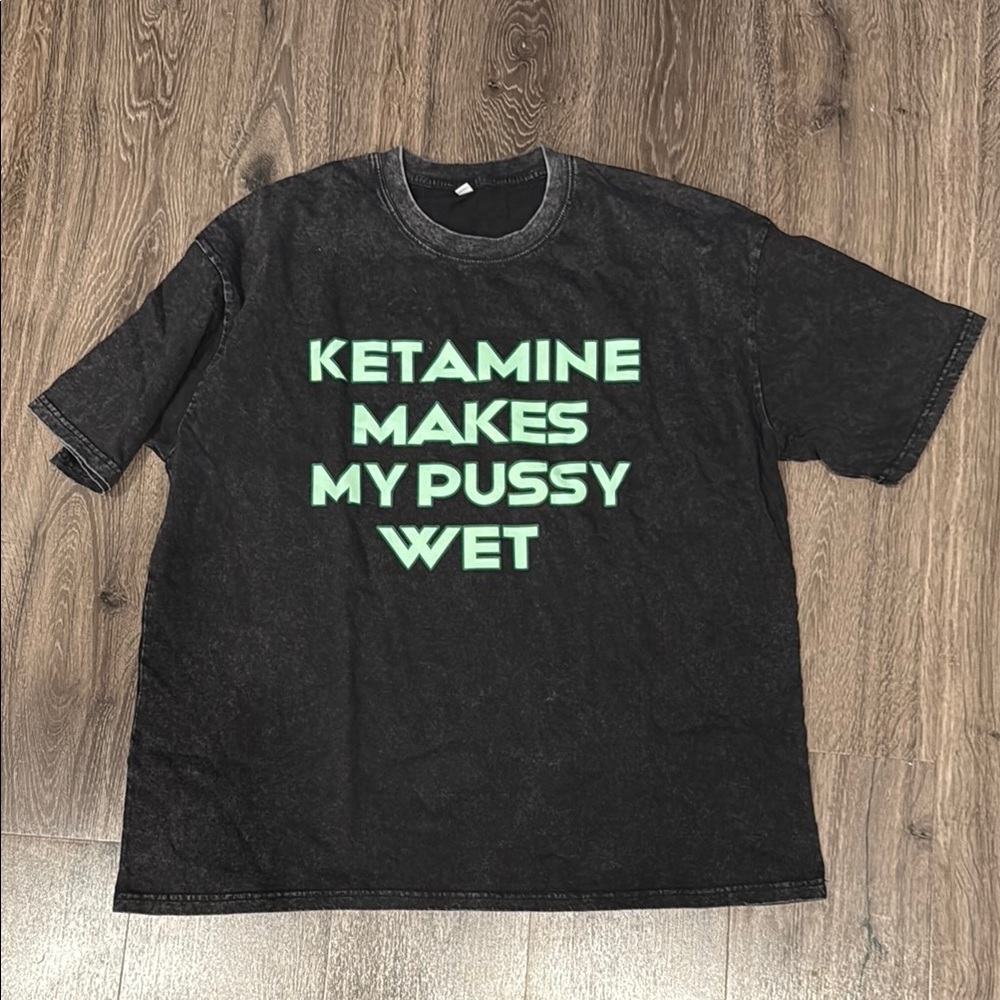 Black T-Shirt with Green Text